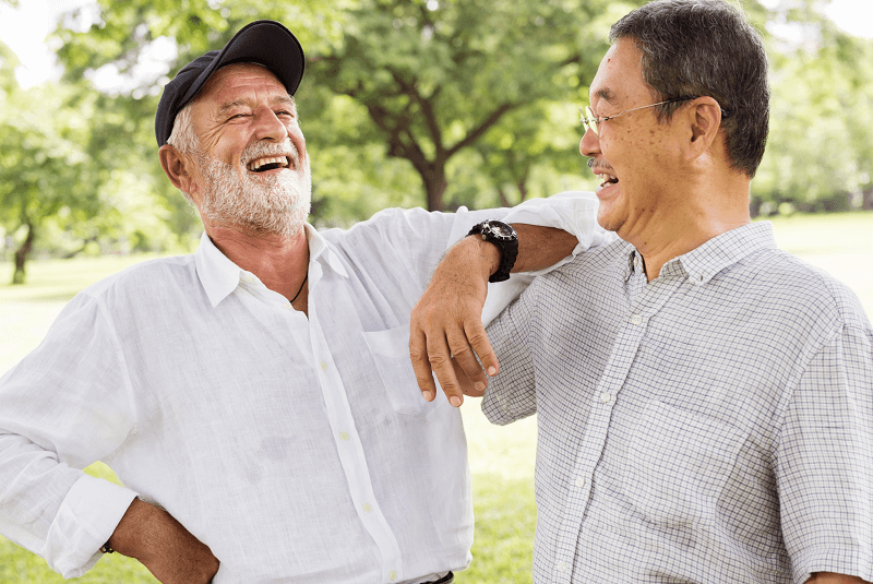Two men talking and laughing